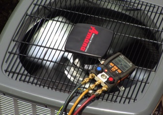 Performing a Air Conditoning Repair in Sherwood Park by Global Heating Services on a Amana Air Conditioner